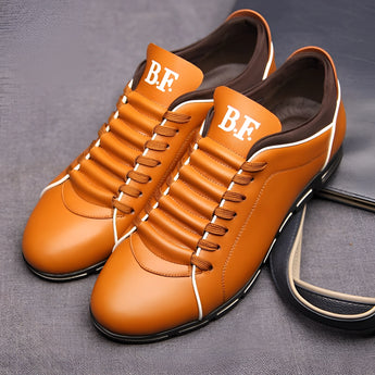 Men's red leather dress shoes in a stylish pointed loafer design with an orange hue, showcasing a sophisticated and elegant appearance.