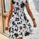 
A black and white sleeveless floral skater dress with an A-line silhouette, designed for summer wear, showcasing a stylish and fashionable day dress look.