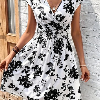 Black and white sleeveless floral skater dress with an A-line silhouette, featuring a summer-ready design perfect for casual outings.