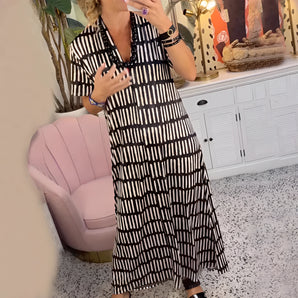 Black and white stripe maxi dress in a flowy, casual button-down design, worn by a model in a 2XL size.