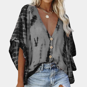 Black and white tie-dye V-neck blouse with long sleeves and a bohemian summer style.