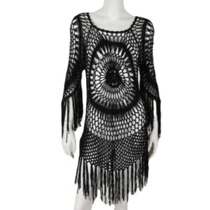 Bohemian-style black crochet dress featuring fringe details, designed for festival wear.