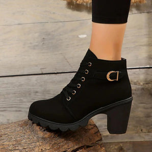 Black chunky heel women's lace-up ankle boots with a stylish combat design, featuring a robust heel and sleek lace-up closure.