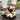 White chunky platform sandals with straps, designed for women, displayed on a model's feet. The sandals feature a summer style and are shown in size 42 against a neutral background.