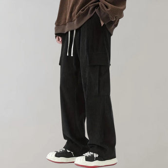 Black corduroy cargo pants made of durable cotton with a soft drawstring, designed for a comfortable fit.