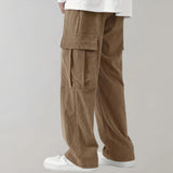 Black corduroy cargo pants made from durable cotton with soft drawstring, featuring multiple pockets and a fashionable design.