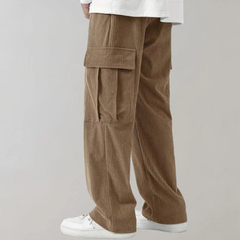 Black corduroy cargo pants made from durable cotton with soft drawstring, featuring multiple pockets and a fashionable design.