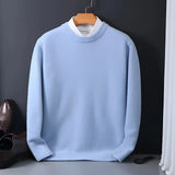 Elegant men's black crewneck sweater featuring a white collar, displayed in light blue color, size 3XL. The sweater's design combines jersey and textile elements, highlighting its stylish and versatile nature.