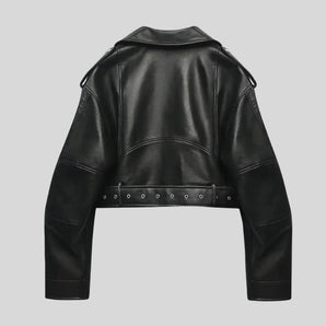 Black cropped leather moto jacket with grommet and studded hem, featuring long sleeves and a stylish collar.