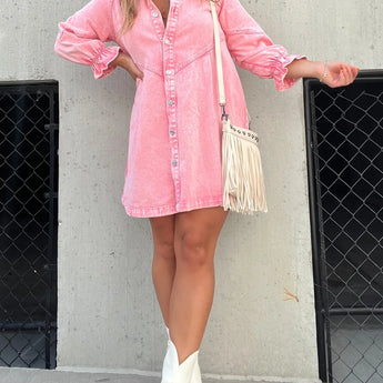 Black denim dress with a fringed purse, paired with western ankle boots, displayed on a mannequin against a plain background. The dress has long sleeves and a defined waistline, suitable for a size XXL.