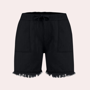 Black denim shorts for women featuring a frayed hem and tie-waist, styled for summer.