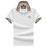 A black designer polo shirt featuring a plaid collar and a gold crest on the chest, displayed in a white 3XL variant.