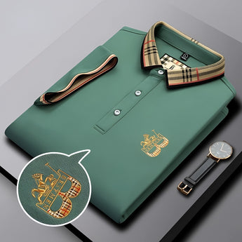 Black designer polo shirt with plaid collar and gold crest logo displayed.