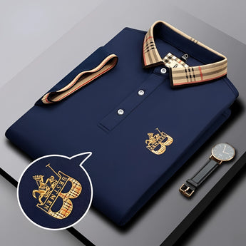 Black designer polo shirt with plaid collar and gold crest, featuring short sleeves and stylish design.