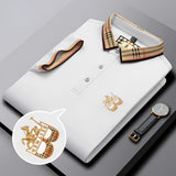 Black designer polo shirt with a plaid collar and gold crest.