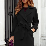 
Black double-breasted women's trench coat with a formal and elegant design, featuring long sleeves and a structured collar, suitable for winter wear.