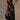 Black floral sheer one-shoulder evening dress with a fitted waist and flowing gown design.