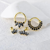 Elegant black gemstone hoop earrings in luxury gold with crystal charms, showcasing a fashionable and creative design for special events.