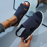 Dark blue rhinestone sandals with a black glitter finish, shown in size 42, displaying the sandals on a model's feet and emphasizing the trendy and comfortable design.