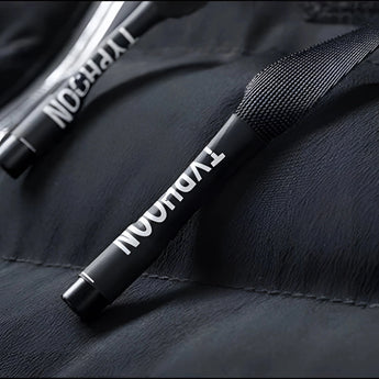 Black glossy quilted leather jacket with luxurious design, featuring long sleeves and a sleek, sophisticated appearance.