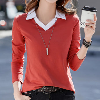 Black and green v-neck blouse displayed on a mannequin, showcasing a stylish design suitable for both office and casual wear.