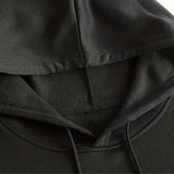 Black hoodie with soft texture and comfortable fit, featuring deep pockets and durable material.