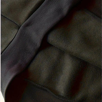 
A black hoodie with a soft texture and comfortable fit, featuring durable fabric and deep pockets, displayed with visible sleeves and a collar.