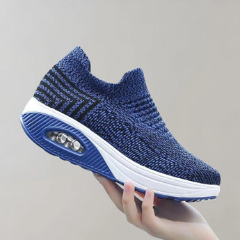 Black knit slip-on sneakers ideal for sports and outdoor activities, featuring a breathable and lightweight design with electric blue accents, suitable for walking or athletic use.