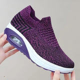 Purple slip-on sneakers with a knit design, featuring a breathable and lightweight construction suitable for sports and outdoor activities, size 43.