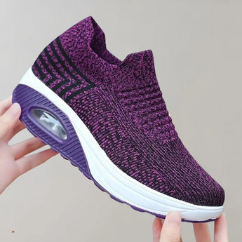 Purple slip-on sneakers with a knit design, featuring a breathable and lightweight construction suitable for sports and outdoor activities, size 43.