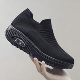 
A pair of black knit slip-on sneakers designed for sports with a breathable and lightweight construction, shown in size 43.