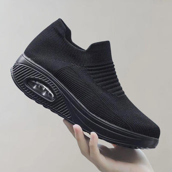 
A pair of black knit slip-on sneakers designed for sports with a breathable and lightweight construction, shown in size 43.