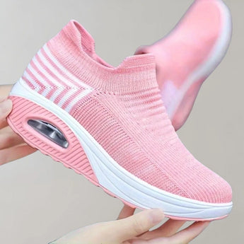 Black knit slip-on sneakers featuring a breathable and lightweight design, ideal for sports and walking activities.