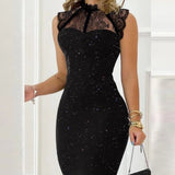
A sleeveless black lace evening gown with glitter detailing, featuring a high-neck design and fitted waist, displayed on a mannequin.
