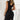 Black lace glitter evening gown with a sleeveless high-neck design, showcasing intricate lace detailing and a fitted silhouette. The dress is elegantly styled for formal occasions.