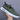 Men's black lace-up low-top sneakers in a green color variant, size 47, showcasing a fashionable and comfortable design suitable for outdoor and athletic activities.