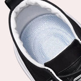 Black lace-up low-top sneakers for men, designed for both fashion and comfort.