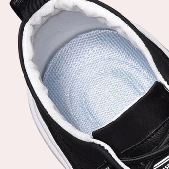 Black lace-up low-top sneakers for men, designed for both fashion and comfort.