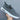 Gray low-top lace-up sneakers for men, designed for comfort and fashion, featuring a sporty and casual style suitable for walking and outdoor activities.