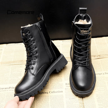 Black leather fur-lined insulated winter combat boots with a sturdy design suitable for cold weather conditions.