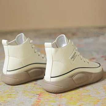 Black leather high-top sneakers with a thick sole, designed for urban fashion.