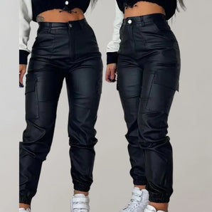 A woman wearing black leather high-waist cargo pants with multiple pockets, designed for a stylish look. The pants are shown in size XL.