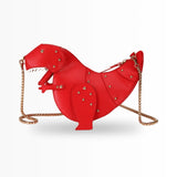 Black leather crossbody bag in the shape of a horse, featuring a gold chain strap and accented with red details.