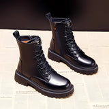 Black leather insulated combat boots with fur lining and rugged soles, featuring steel-toe protection, suitable for work environments.