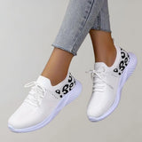 Black leopard print women's stylish comfortable sneakers with white accents, shown in size 42.5, featuring a fashionable design suitable for casual wear.
