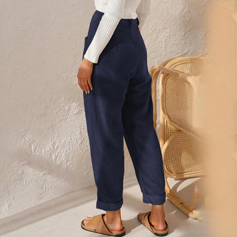 Black linen high-waist cargo pants for women, designed for casual summer wear, highlighting features such as a comfortable waistline and relaxed fit throughout the thighs and knees.