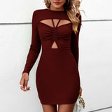 
A woman wearing a wine red XL black long sleeve cut-out bodycon mini dress, perfect for party wear, showcasing the dress's sheath design with shoulder cut-outs, while highlighting her hairstyle and elegant posture.