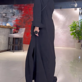 Black long sleeve maxi dress with pockets, featuring an elegant and versatile design.