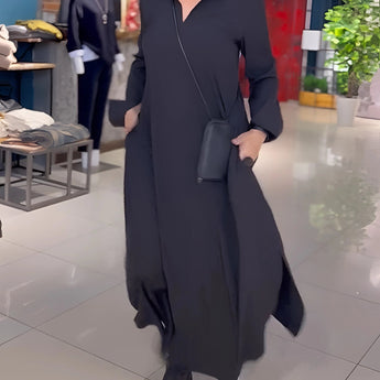 
A black long sleeve maxi dress with pockets in midnight black, designed for elegance and versatility. The dress features a flattering waistline and is shown in a 3XL size, capturing a formal yet fashionable look.