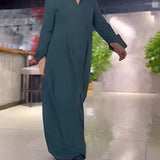 
Elegant black long sleeve maxi dress with pockets, featuring a fitted waist and flowing design, suitable for formal wear.